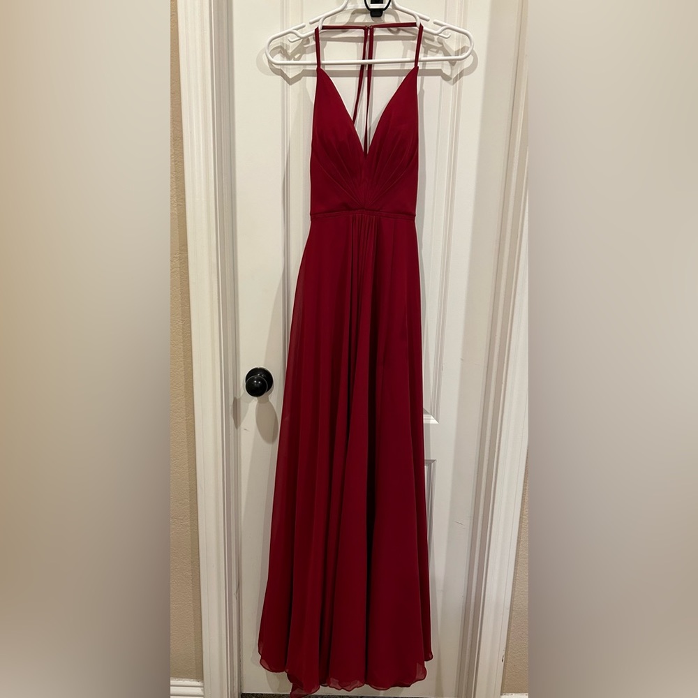 Red prom Dress with hip slit. Low back with criss cross lace up back.